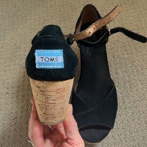 Pre-loved black TOMS wedges in good condition, with bag. W 7.5.
